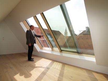 Open attic with sliding skylights - Sliding roof window Solara PERSPEKTIV in the center of Vienna