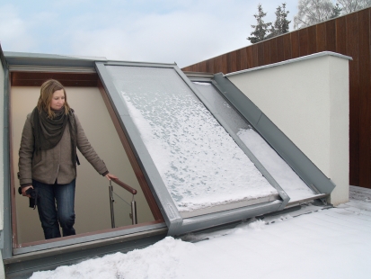 Open attic with sliding skylights - Two-part sliding roof doors Solara PERSPEKTIV, cladding made of Rheinzinc