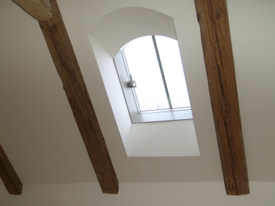 Unique design of the roof window - almost double the illumination of the historic attic - <Roof window> Solara KLASIK Rondo, replica of a historical chimney exit, gray wood spray</Roof window>