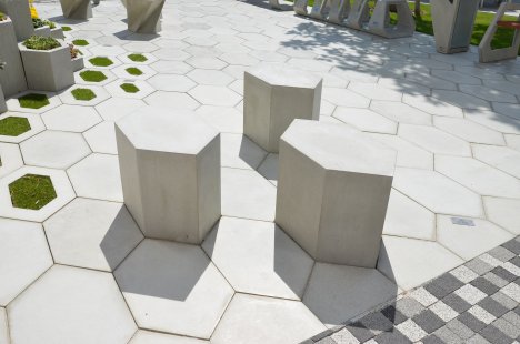 Unusual hexagonal paving H-E-X and urban furniture