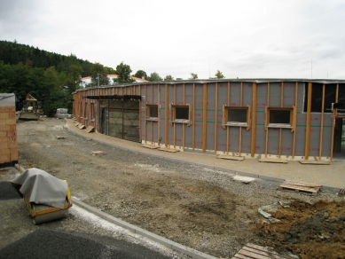 The building of the Regional Directorate of the Forests of the Czech Republic in Zlín by the Studio 97 A atelier - The southern and southeastern part of the building uses contact with the landscape – parking spaces and garages for staff are arranged in a cut into the terrain.